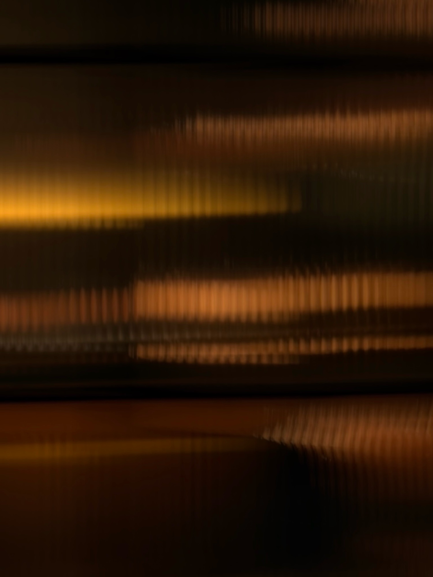 Golden light through reeded glass